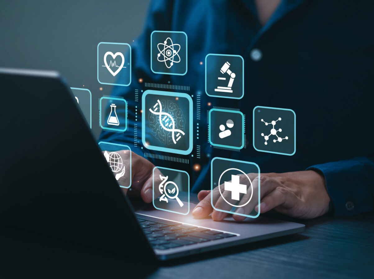 Biotechnology Concept: Businessman Uses a laptop on Biotechnology Icons representing digital health technology, Research, Development, Innovation, Advancing Smart Solutions from Digital Technology.